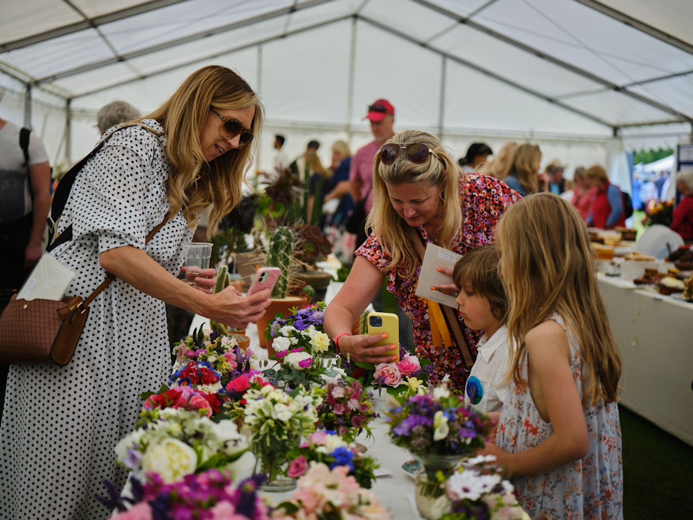 Women and children looking at exhibits at Royal Windsor Flower Show